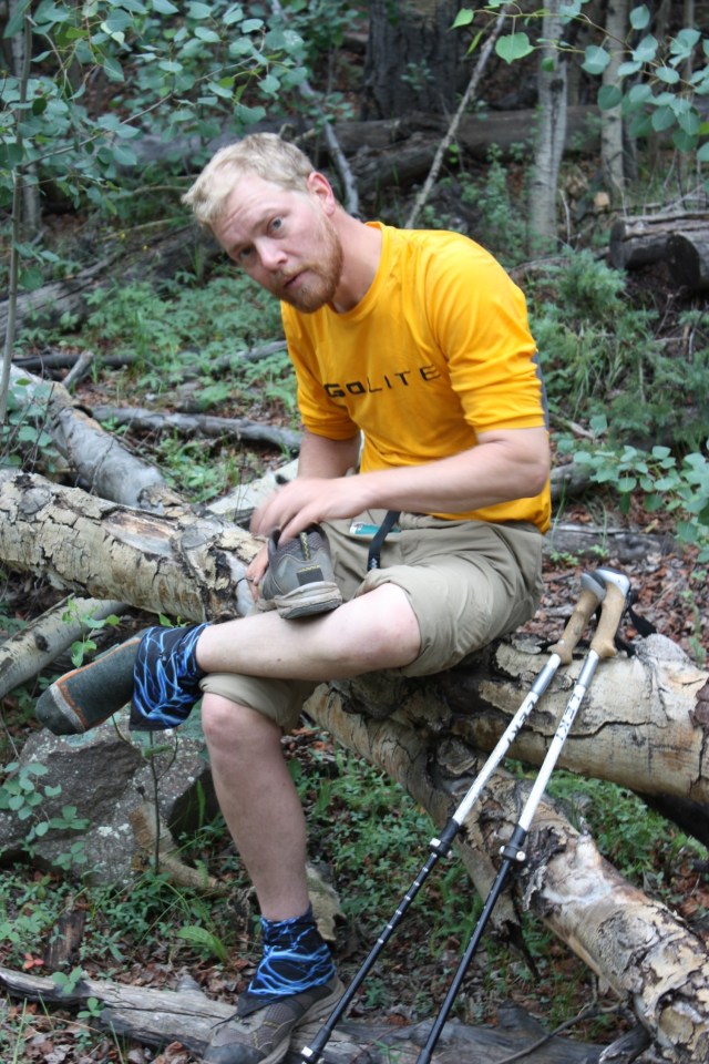 Junaid fixing his shoelaces.