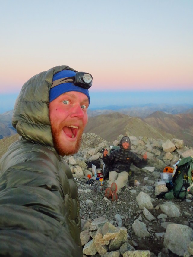Junaid and Luke celebrating the sun on top of Tabeguache with a cup of coffee.