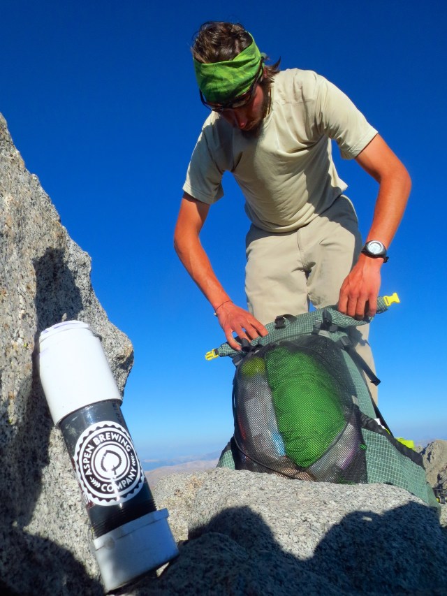 Luke packs up on the Shavano summit.