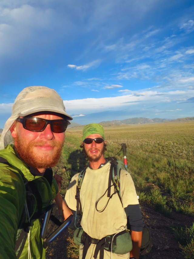 Junaid and Luke at the 1000-mile mark. Several motorists were undoubtedly confused as to why two grungy guys in backpacks could be so happy on the side of this long lonely road that they were raising their flasks to them and cheering.