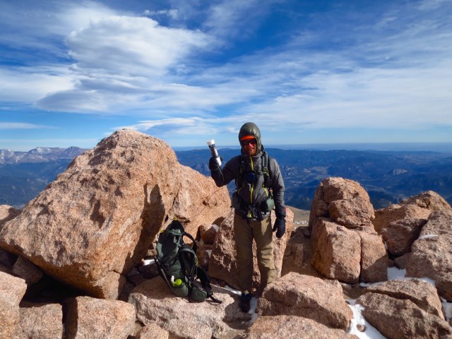 Junaid with the Longs Peak summit register.
