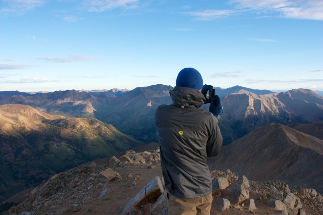 Junaid capturing a panorama on Huron's summit.