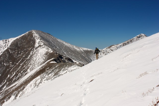 Junaid heads towards Argentine Pass with Toreey's and Gray's Peak in the background.